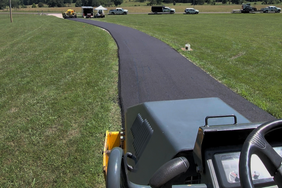 Asphalt Driveway Compaction Roller compacting newly installed asphalt on a Salem, Missouri driveway