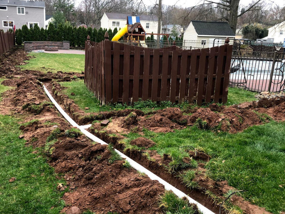 Underground PVC Pipes Drain Water from Backyard to Street
